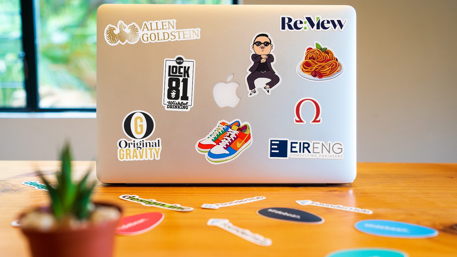 Re:View Branding | Client Logo Stickers on Laptop